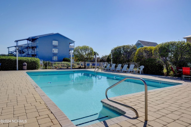 view of swimming pool featuring a patio