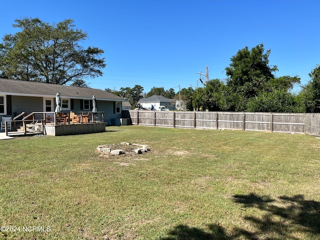 view of yard with a wooden deck