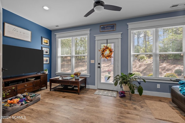 interior space with ceiling fan, light wood-type flooring, and a wealth of natural light