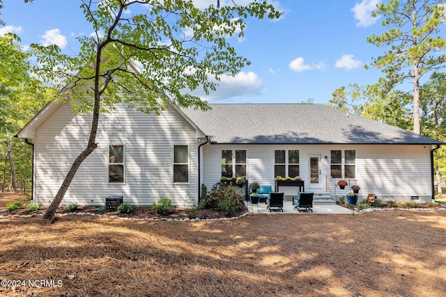 back of house with a patio area