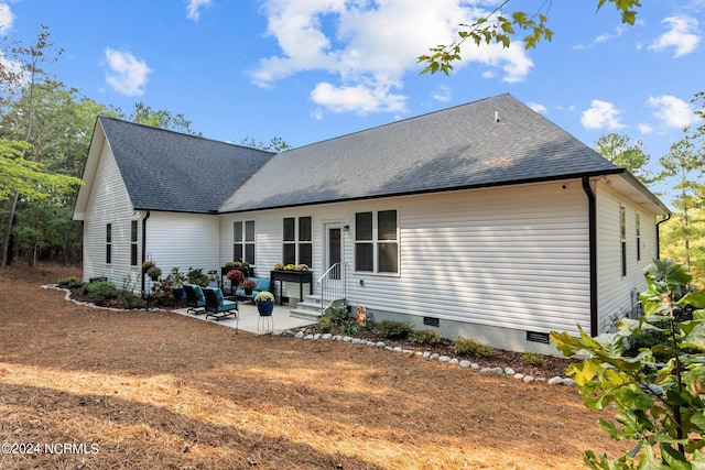 back of property featuring a patio