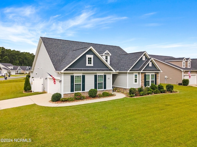 view of front of property featuring a garage and a front yard