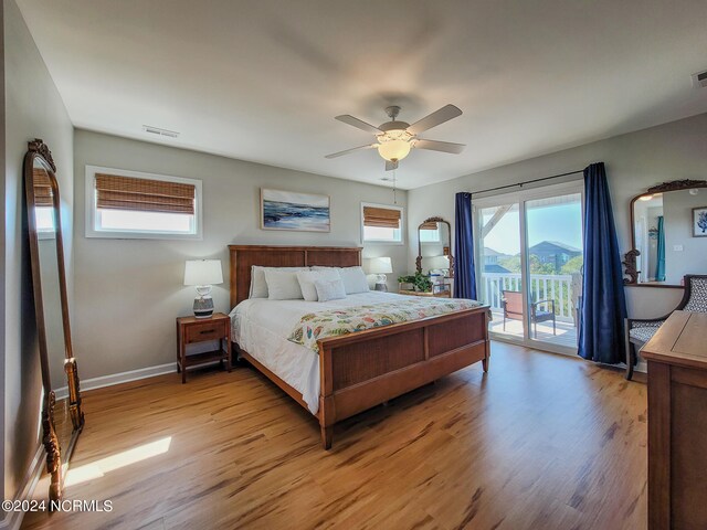 bedroom with access to outside, light hardwood / wood-style floors, and ceiling fan