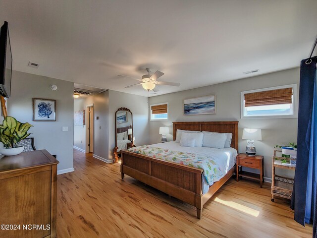 bedroom featuring light hardwood / wood-style flooring and ceiling fan