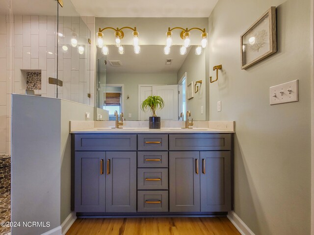 bathroom with vanity and hardwood / wood-style flooring