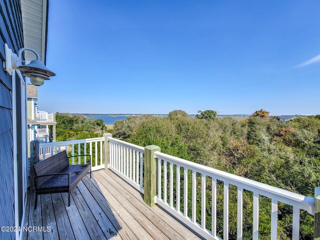 wooden deck with a water view