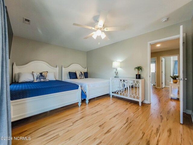 bedroom with ceiling fan and light wood-type flooring