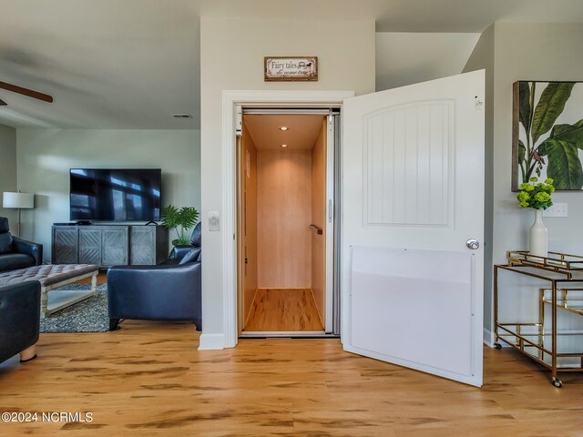 corridor featuring light hardwood / wood-style floors