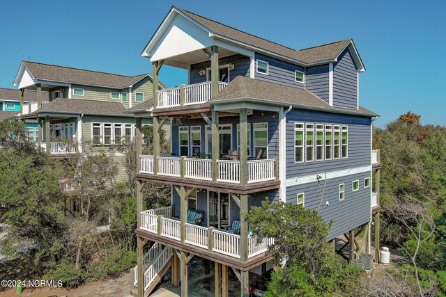 rear view of house featuring a balcony