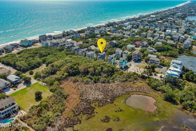 bird's eye view featuring a beach view and a water view