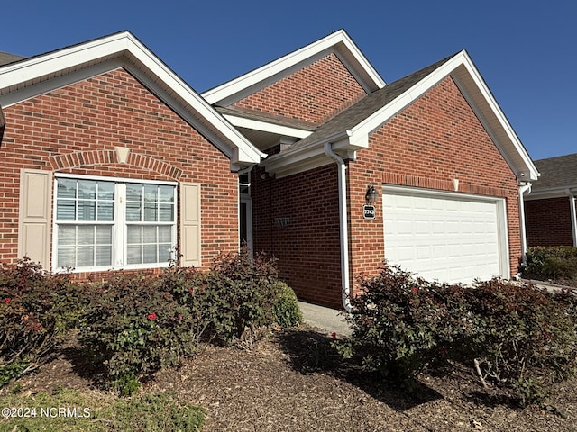 view of property exterior featuring a garage