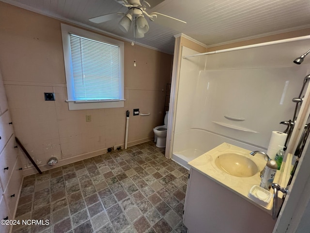 bathroom featuring vanity, ornamental molding, a shower, tile walls, and toilet