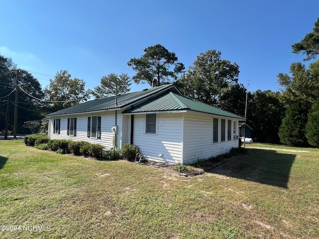 view of property exterior featuring a yard