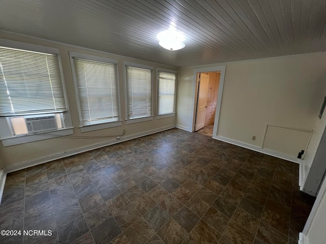 unfurnished room with wooden ceiling and cooling unit