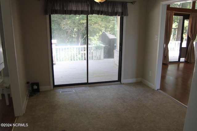 spare room featuring plenty of natural light