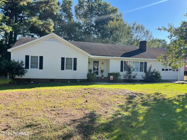 ranch-style house with a garage and a front yard