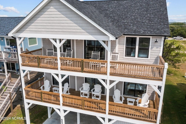 back of house with a wooden deck