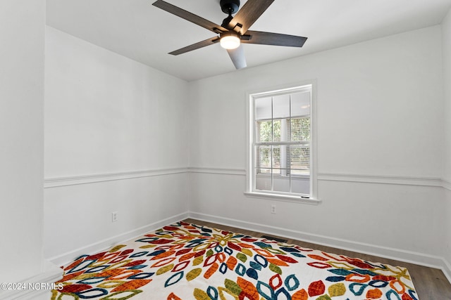 empty room featuring hardwood / wood-style flooring and ceiling fan