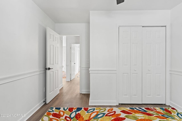 bedroom featuring light hardwood / wood-style flooring and a closet