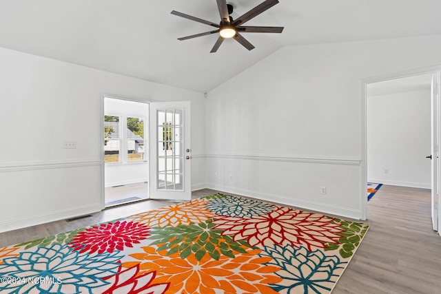 entryway featuring hardwood / wood-style floors, ceiling fan, and lofted ceiling