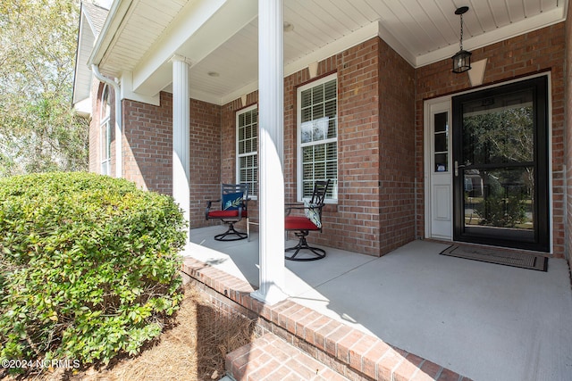 doorway to property with covered porch