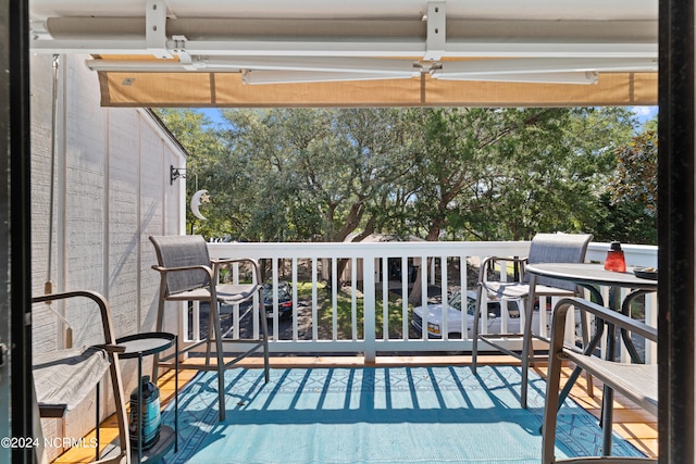 wooden balcony featuring a deck