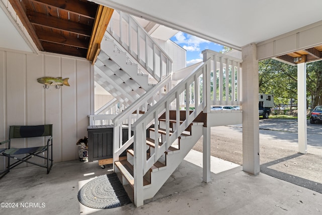 stairs with a skylight