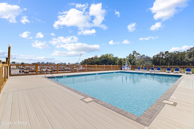 view of pool featuring a wooden deck