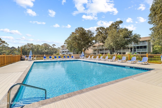 view of swimming pool featuring a deck