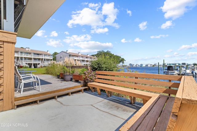 exterior space with a deck with water view