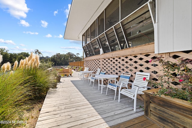 wooden terrace featuring a sunroom