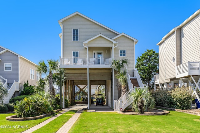 rear view of property featuring a carport and a lawn