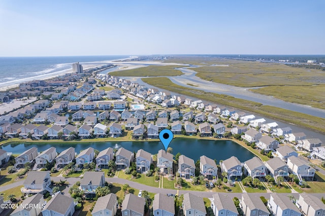 bird's eye view with a residential view and a water view