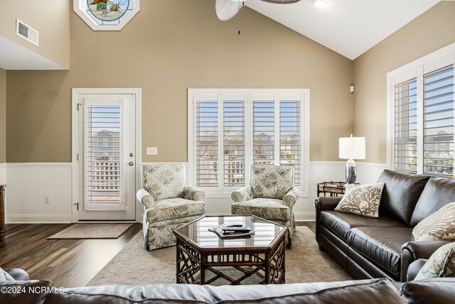 living room featuring dark hardwood / wood-style floors and ceiling fan