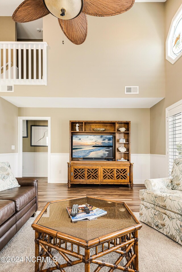 bedroom featuring ceiling fan, light colored carpet, and ornamental molding