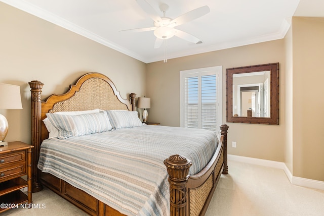 bedroom with light carpet, ceiling fan, baseboards, and ornamental molding