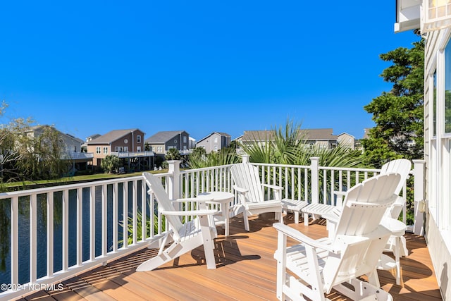 wooden terrace with a residential view