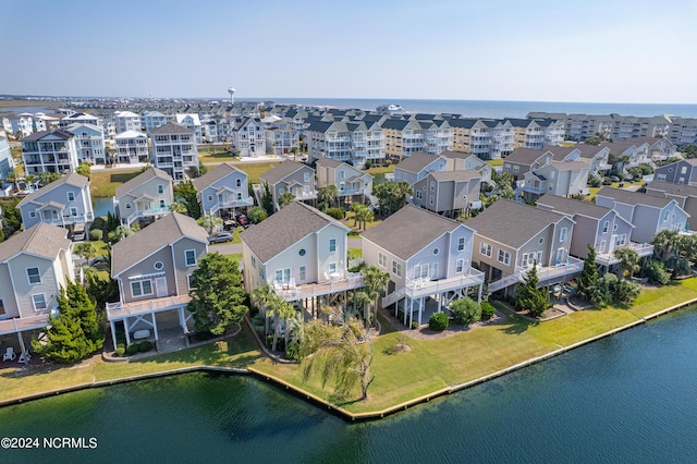 birds eye view of property featuring a water view and a residential view