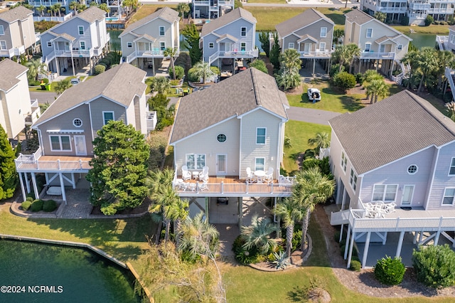 birds eye view of property with a residential view and a water view