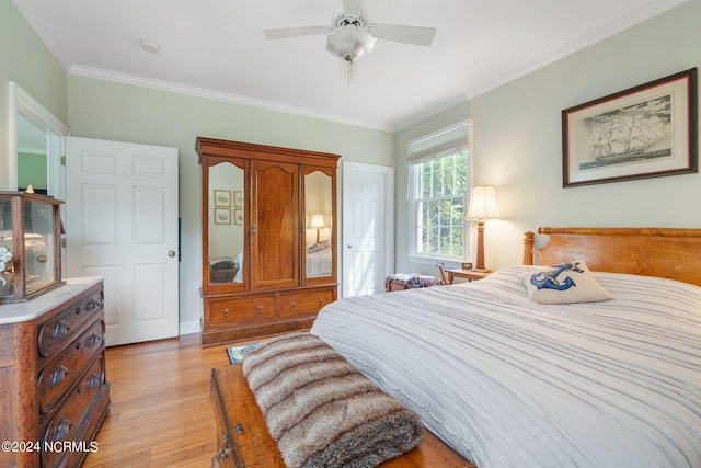 bedroom with ceiling fan, light hardwood / wood-style floors, and ornamental molding