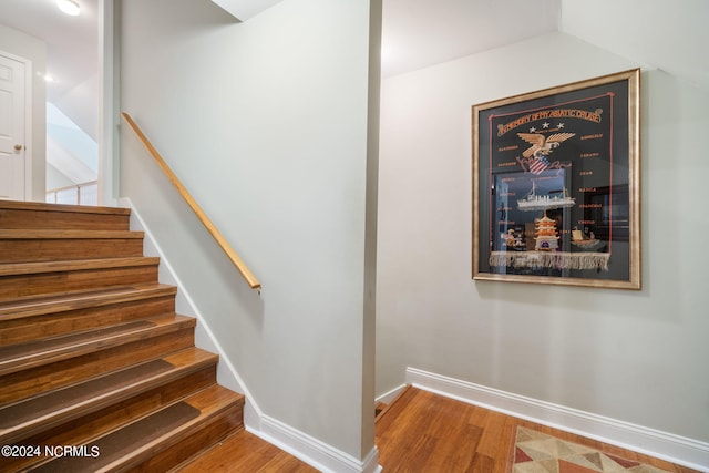 stairway with wood-type flooring