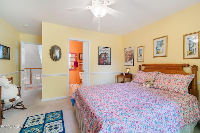 carpeted bedroom with connected bathroom and ceiling fan