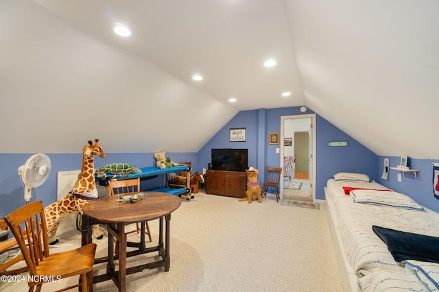 interior space with carpet floors and vaulted ceiling