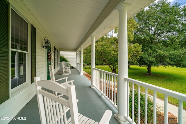 wooden terrace with a yard