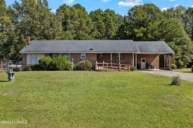 ranch-style house with a front lawn and a carport