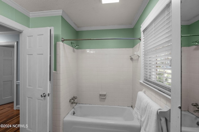 bathroom with crown molding, tiled shower / bath, hardwood / wood-style flooring, and a textured ceiling