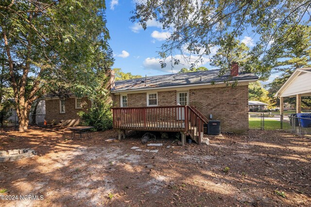 back of house featuring a deck and central AC