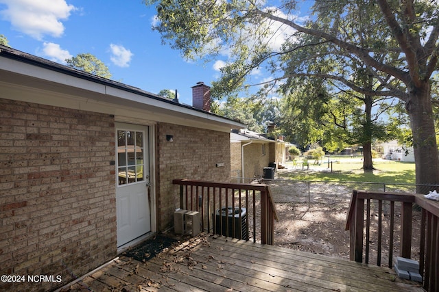 wooden deck with central air condition unit