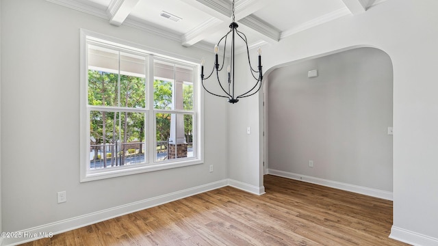 unfurnished dining area featuring a chandelier, plenty of natural light, visible vents, and beamed ceiling