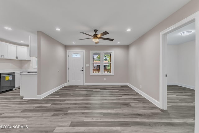 foyer with ceiling fan and light hardwood / wood-style floors